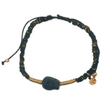 Black cord bracelet, gold and black skull