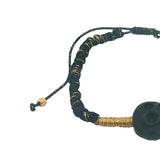Black cord bracelet, gold and black skull