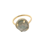 Golden ring with faceted stone and zircons