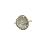 Golden ring with faceted stone and zircons