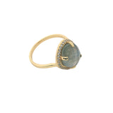 Golden ring with faceted stone and zircons