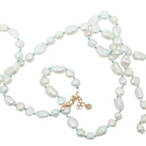 Collier doré perles de culture de différentes tailles avec noeuds turquoise 75 cm