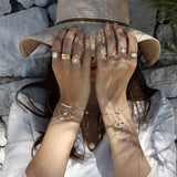 Braided gold bracelet with small stones