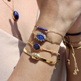 Braided gold bracelet with small stones