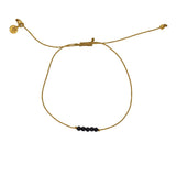 Braided gold bracelet with small stones