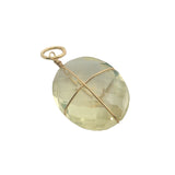 Charms doré quartz citron ovale facetté entouré d'un fil doré