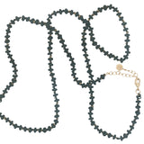 Collier doré perles noires avec noeuds noirs et dorés 64 cm