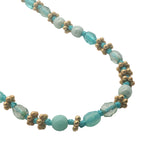 Collier doré perles turquoises, couronnes dorées et noeuds turquoises 42 cm