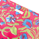 Grande pochette de voyage rouge et verte à fleurs bleues