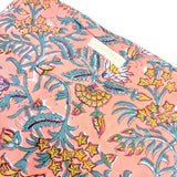 Grande pochette de voyage corail et verte à fleurs jaunes et blanches