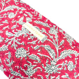 Petite pochette rouge à fleurs blanches