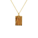 Collier plaque dorée corps de femme