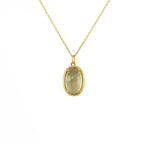 Collier doré scarabée pierre bombée