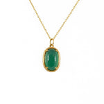 Collier doré scarabée pierre bombée