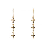 Boucles d’oreilles dorées et croix zircons noirs
