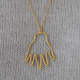 Collier doré pendentif main martelée