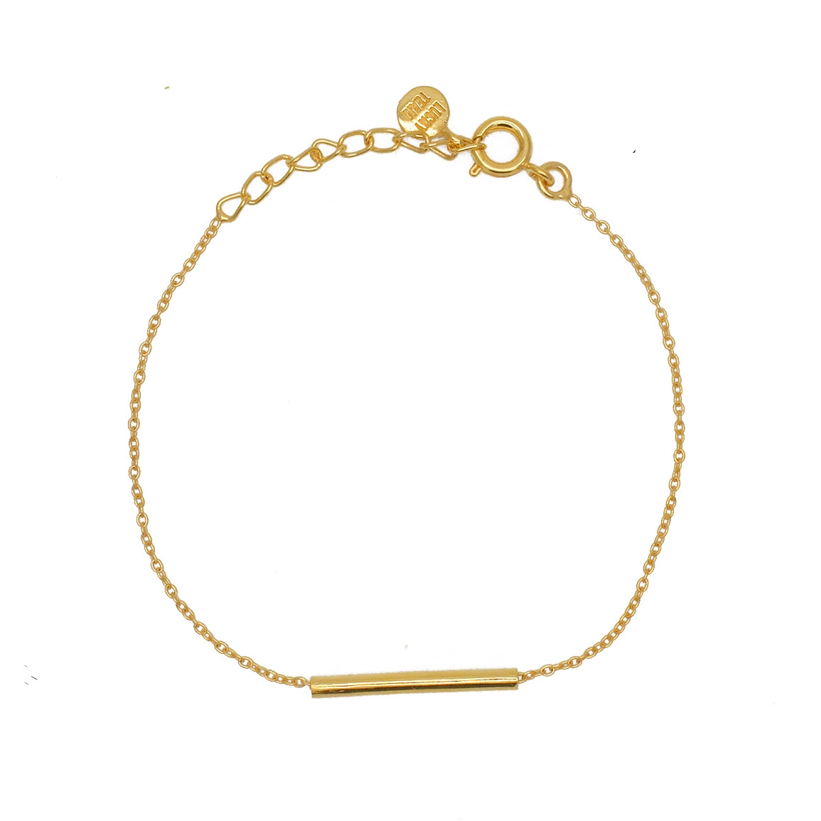 Bracelet doré et tube
