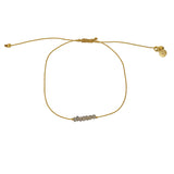 Braided gold bracelet with small stones
