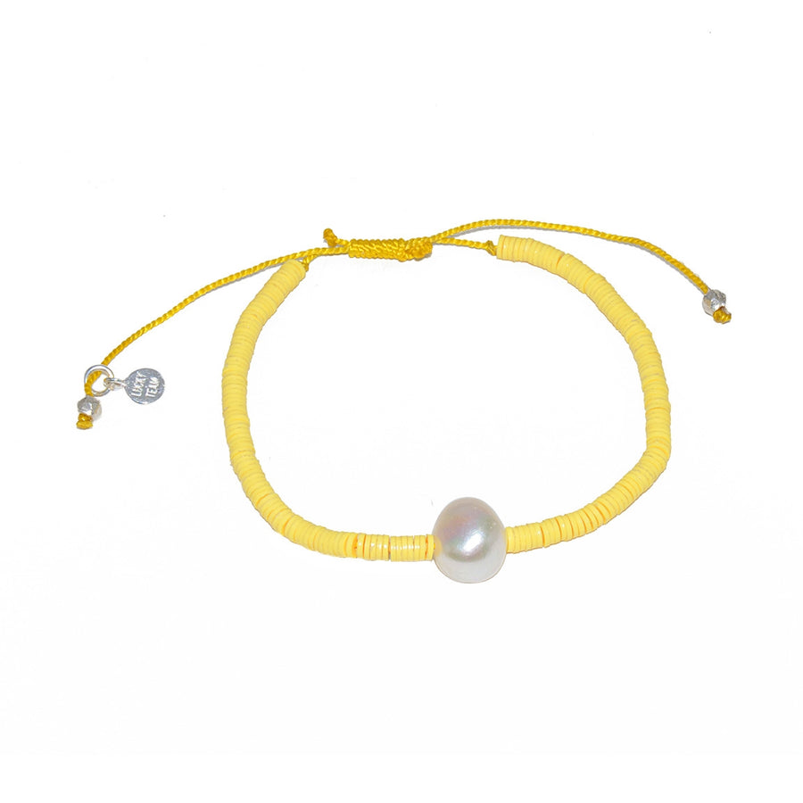Bracelet vinyle jaune et perle de culture