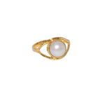 Bague dorée martelée et oeil pierre