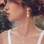 Collier doré demi lune martelée et zircon