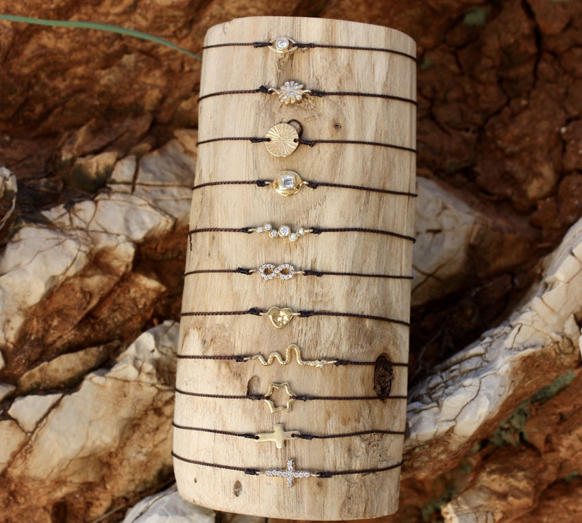 Bracelet tressé infini doré et zircons