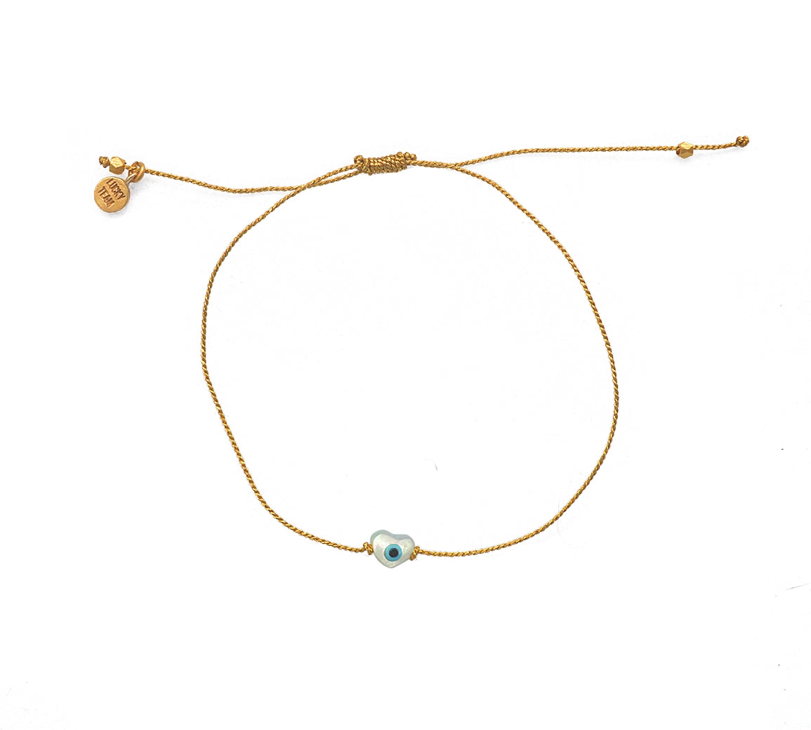 Bracelet tressé doré et coeur oeil nacre
