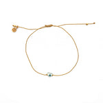 Bracelet tressé doré et coeur oeil nacre