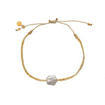 Bracelet tressé beige doré et fleur en nacre