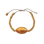 Bracelet cordon disques dorés et coquillage