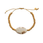 Bracelet cordon doré et coquillage