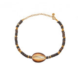 Bracelet de cheville doré et coquillages