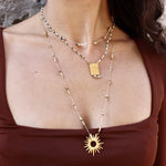 Collier doré pierres et disques dorés