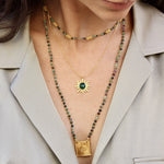 Collier doré soleil et pierre cabochon