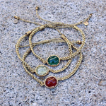 Bracelet cordon tressé doré et pierre cabochon