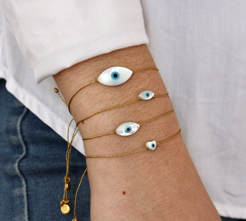 Bracelet tressé doré et coeur oeil nacre