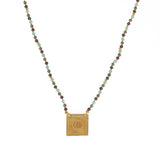 Collier cordon doré pierres et plaque soleil