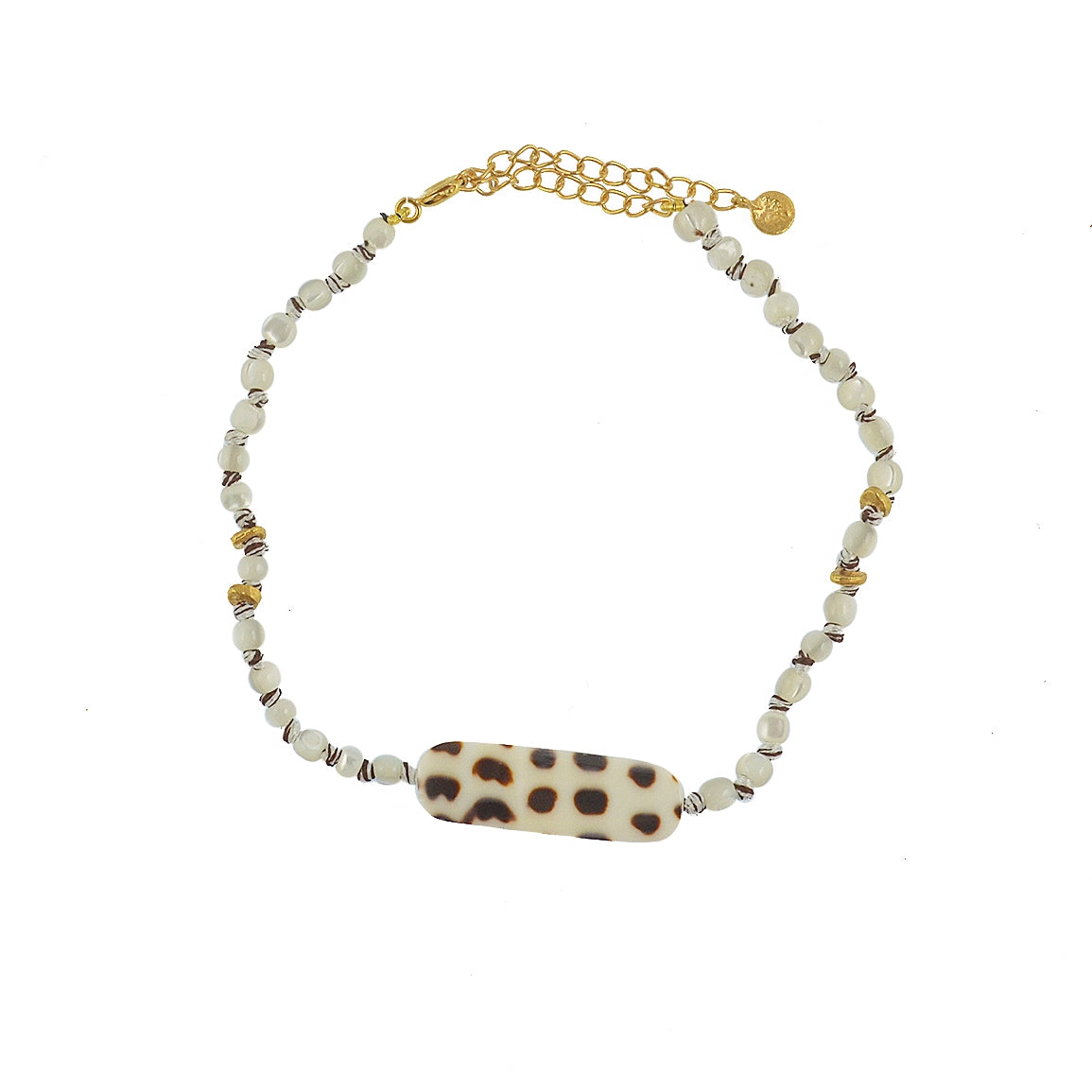 Bracelet de cheville doré et coquillages