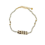 Bracelet de cheville doré et coquillages