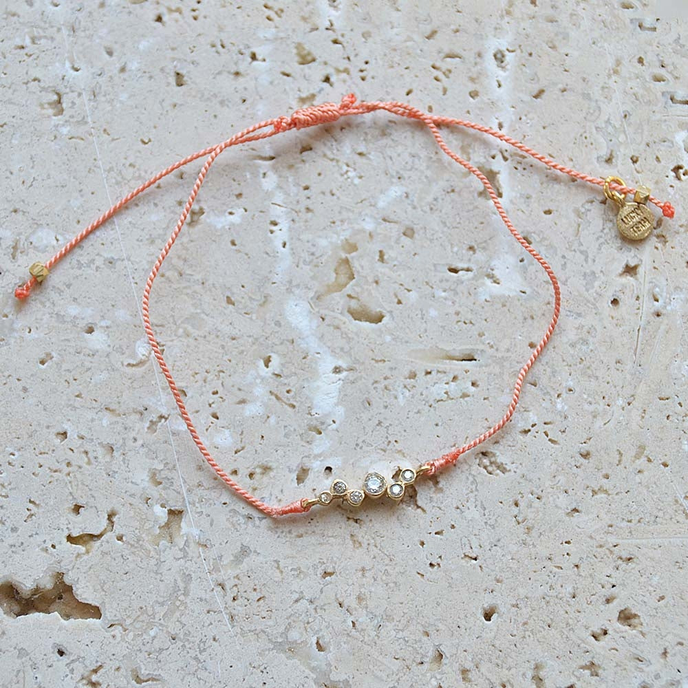 Bracelet tressé et zircons blancs