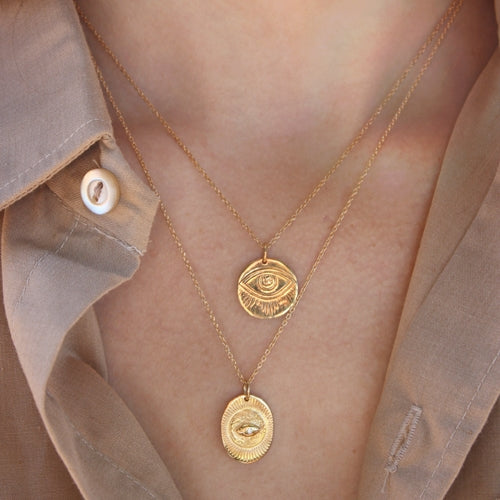 Collier doré pendentif oeil gravé
