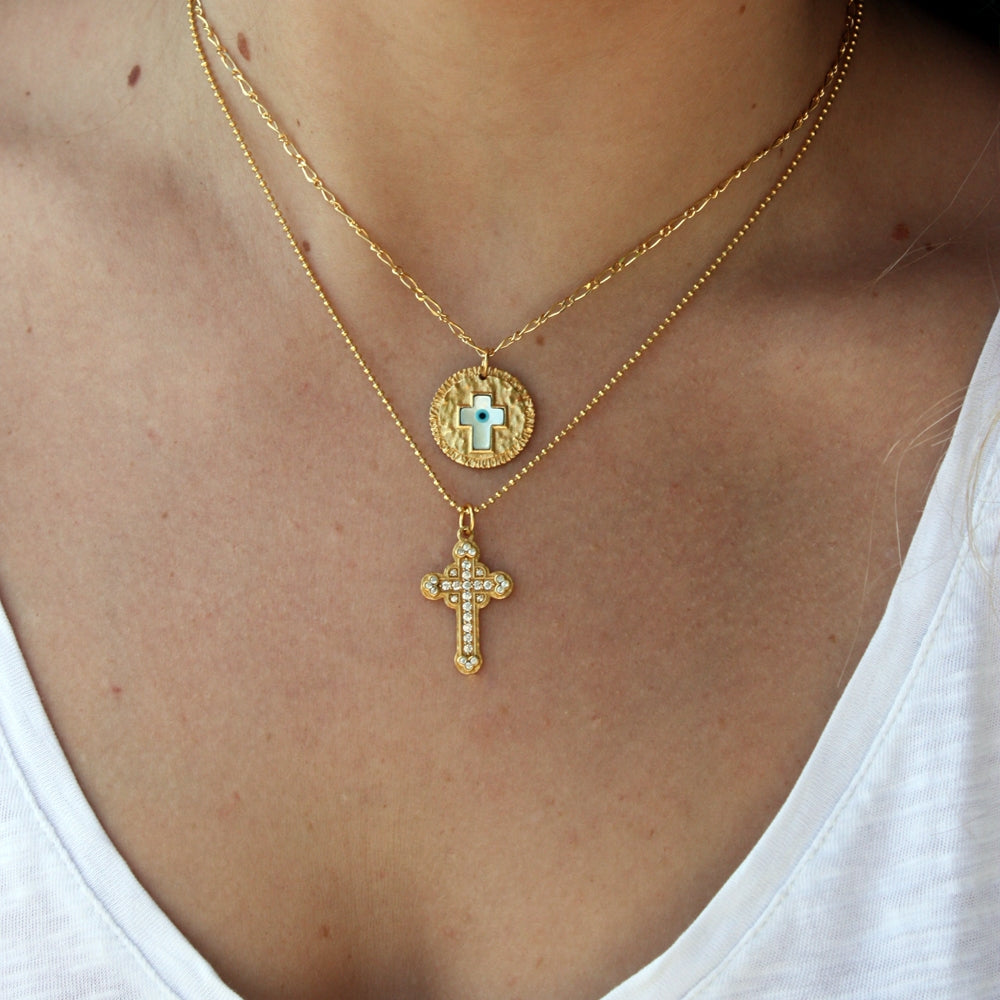 Collier boules croix dorée et zircons blancs