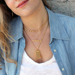 Collier doré pendentif martelé bonheur