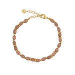 Bracelet doré perles bois allongées