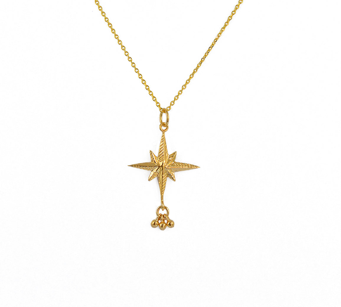 Collier doré pendentif rose des vents texturée et pampilles