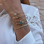 Bracelet doré petite médaille ronde pierre et zircons