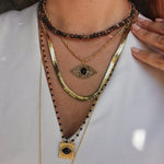 Collier perles bois moucheté