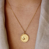 Gold necklace with yin &amp; yang zircon medal