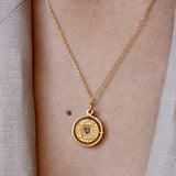 Collier doré médaille pivotante coeur pierre good karma