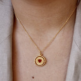 Collier doré médaille pivotante coeur pierre good karma -